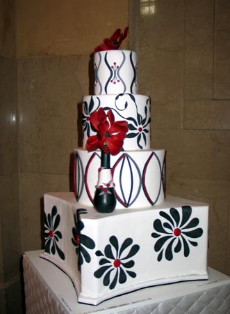 black and white wedding cakes with red flowers