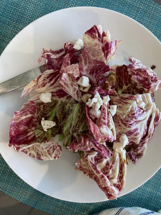 Salad with bitter lettuce, fresh goal cheese (purple haze from Cypress Grove, with fennel pollen and lavender), and hazelnuts with an almond oil and sherry vinegar dressing