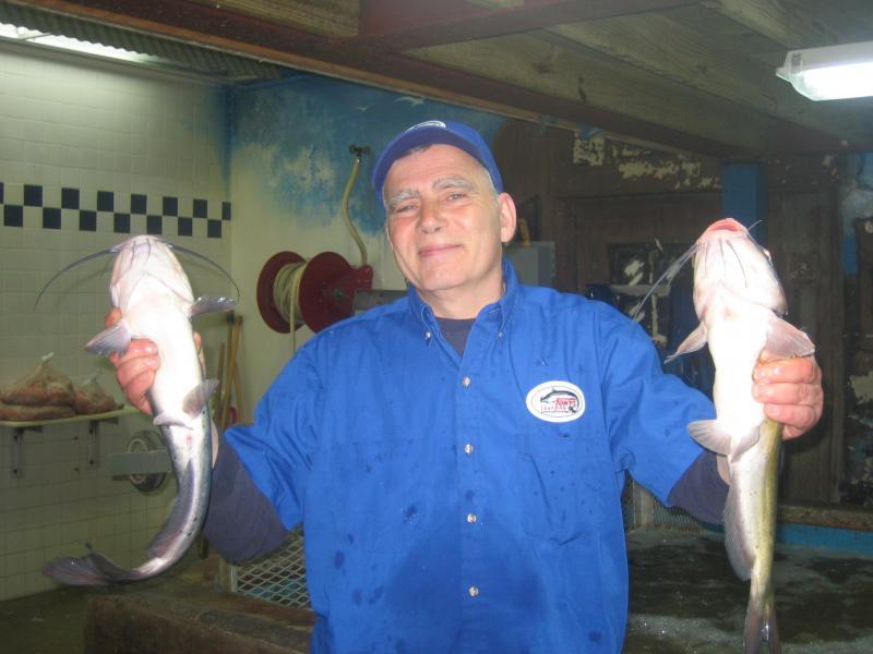 8-man holding fish.JPG