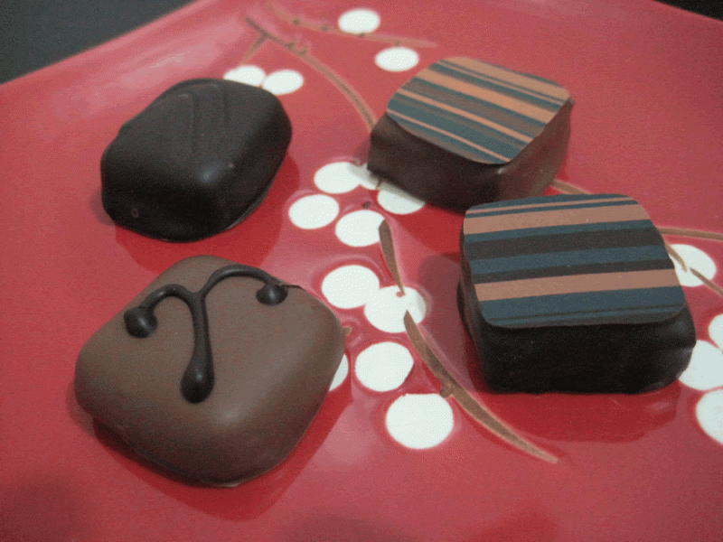 MC_OM_DM.gif></a></p><p>Clockwise from top left: Molasses Caramel dipped in dark, Orange Marmanier dipped in milk, Orange Marmanier dipped in dark, Molasses Caramel dipped in milk.</p><p>I was experimenting with enrobing flavors, finishing designs and the like.</p><p>Don