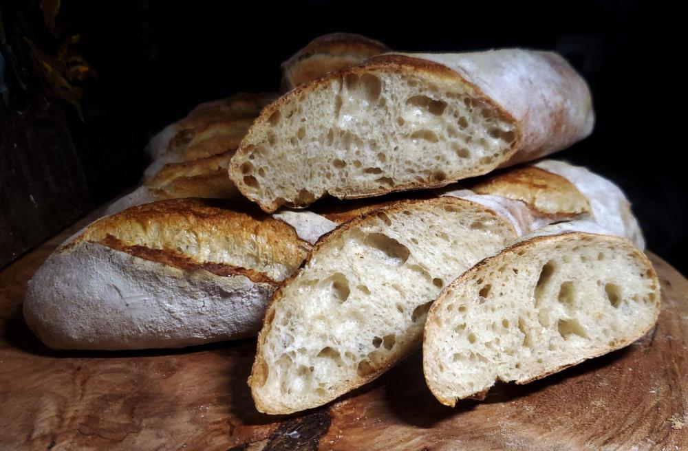 Baguettes June 1st dough with discard and 1g of yeast 16 hour fermentation baked June 2nd  sliced.jpg